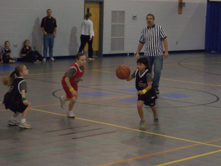Kasen playing Upward basketball